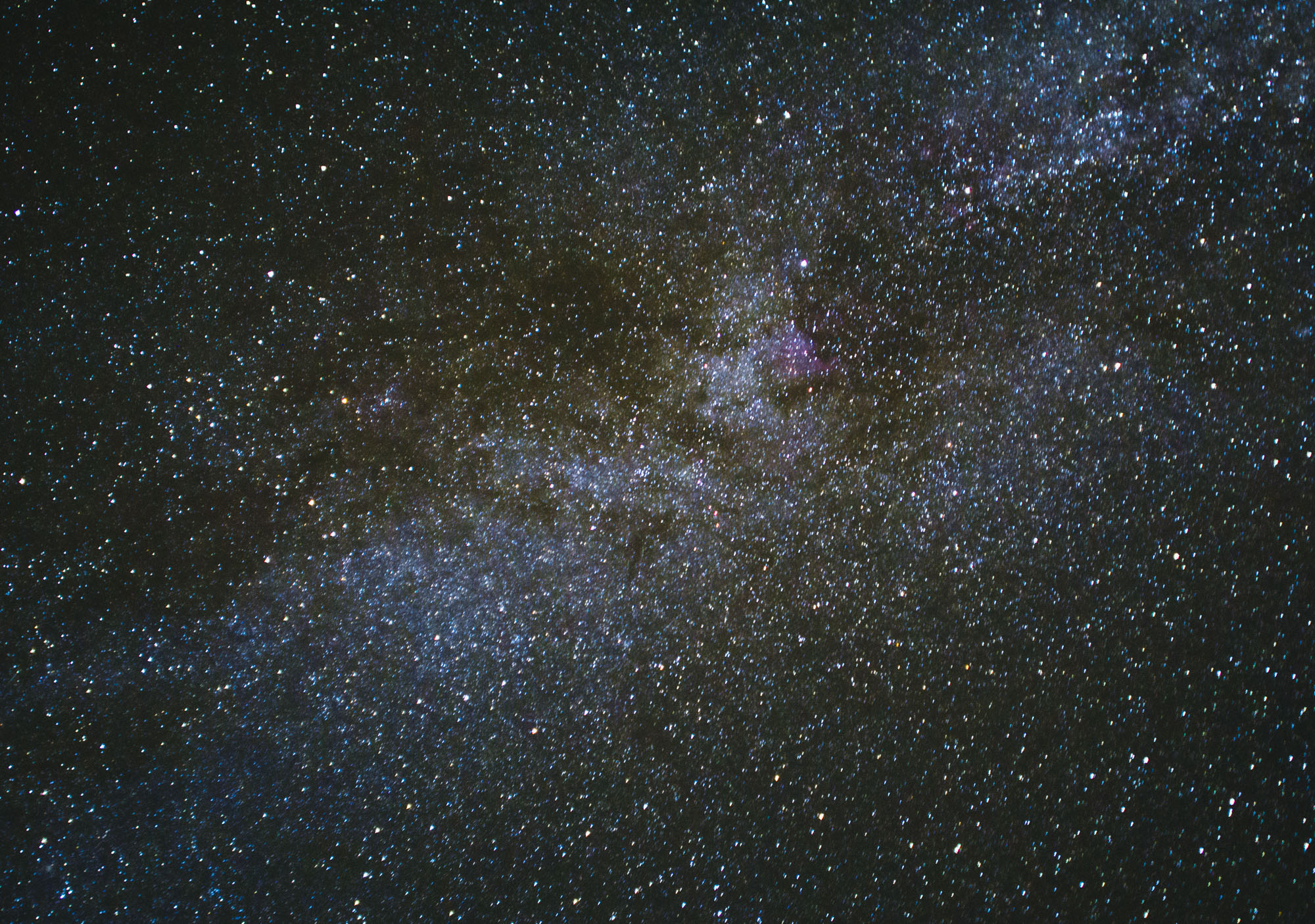 Three 15-second shots of part of the milky way stacked together using photoshop to reduce noise. Edited for color and noise reduction.